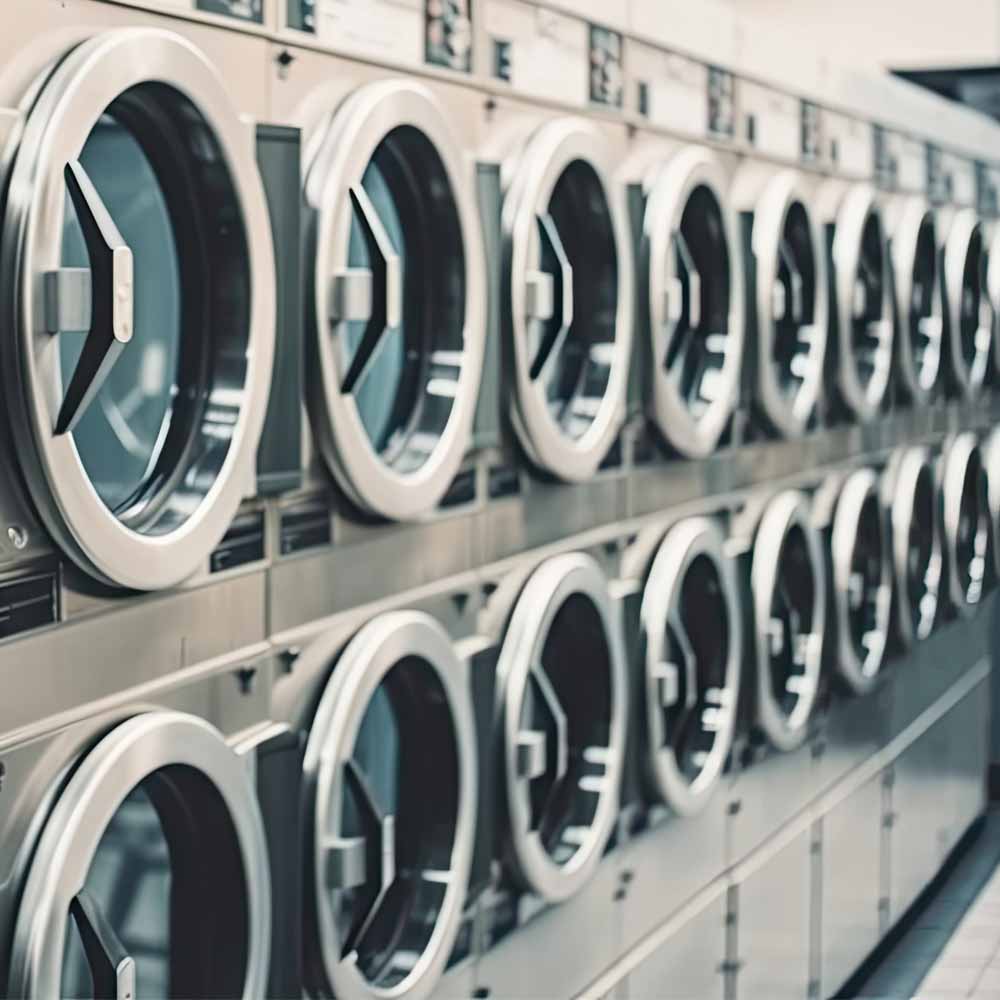 Stacked commercial washing machines
